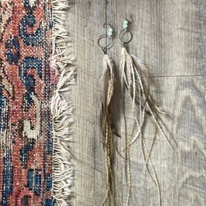 •| feather earrings